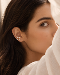 Pearl Bow Stud Earrings worn on model