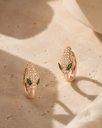 Emerald Eye Serpent Hoop Earrings worn on model